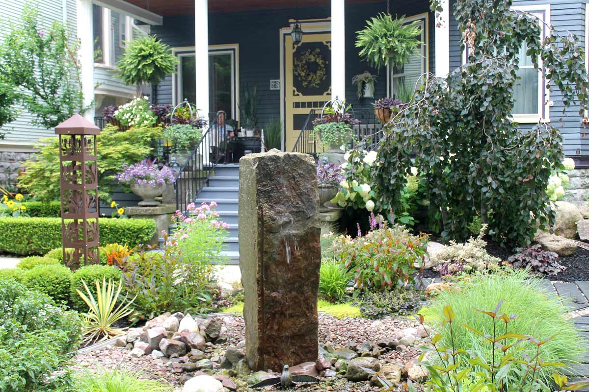 Water fountain in front yard garden